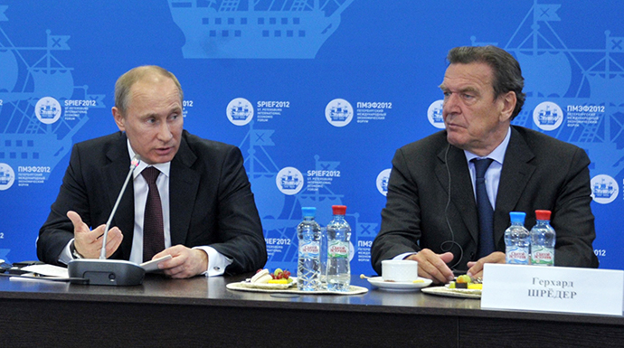 Russian President Vladimir Putin (L) at a meeting with heads of energy companies at the 16th St Petersburg International Economic Forum, 21 June 2012. At right is former German Chancellor Gerhard Schroeder. (RIA Novosti / Aleksey Nikolskyi)