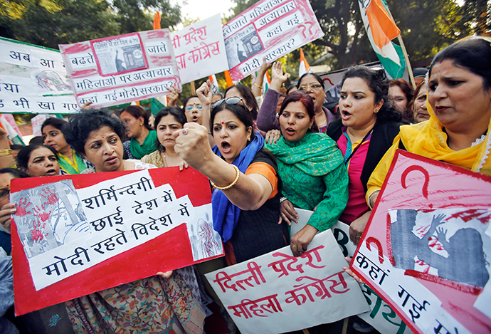 Members of All India Mahila Congress, women's wing of Congress party, shout slogans and carry placards during a protest against the rape of a female passenger, in New Delhi December 8, 2014 (Reuters / Anindito Mukherjee)