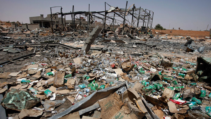 A building used by Gaddafi troops to service vehicles is seen in rubble following a NATO airstrike in the town of Bir al-Ghanam in western Libya, August 8, 2011.(Reuters / Bob Strong)