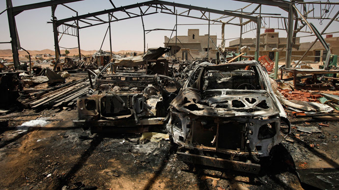 A building used by Gaddafi troops to service vehicles is seen in rubble following a NATO airstrike in the town of Bir al-Ghanam in western Libya, August 8, 2011.(Reuters / Bob Strong)