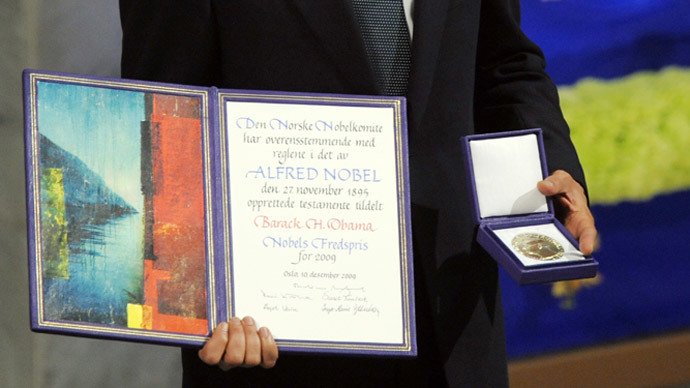 US President Barack Obama holds his Noble Peace Prize during the Nobel Peace Prize Ceremony at the Oslo City Hall in Oslo on December 10, 2009.(AFP Photo / Jewel Samad)