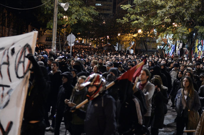 Thousands march in central Athens on December 2, 2014 during a massive march in solidarity with a 22-years old anarchist hunger striker, Nikos Romanos.(AFP Photo)