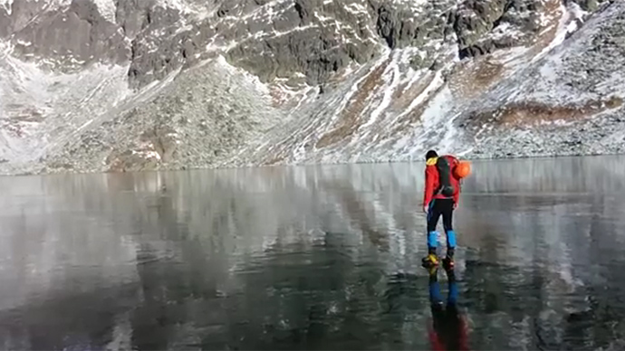 Icy walk on crystal clear mountain lake in Slovakia awes web (VIDEO)
