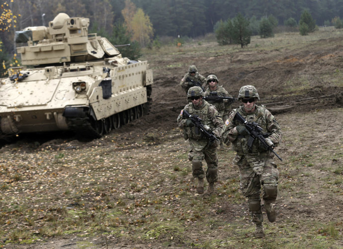 U.S. soldiers deployed in Latvia perform during a drill at Adazi military base October 14, 2014. (Reuters/Ints Kalnins)