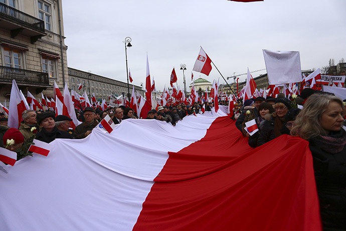 Protesters carry Polish flags during a demonstration march in Warsaw December 13, 2014. (Reuters/Adam Stepien/Agencja Gazeta)