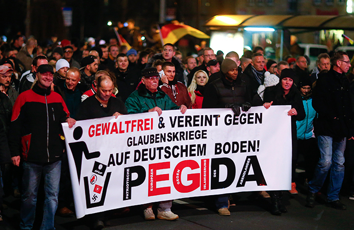 Participants hold a banner during a demonstration called by anti-immigration group PEGIDA, a German abbreviation for "Patriotic Europeans against the Islamization of the West", in Dresden December 15, 2014. (Reuters / Hannibal Hanschke)