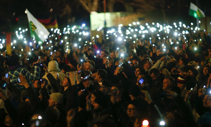 Participants hold up their mobile phones during a demonstration called by anti-immigration group PEGIDA, a German abbreviation for "Patriotic Europeans against the Islamization of the West", in Dresden December 15, 2014. (Reuters)