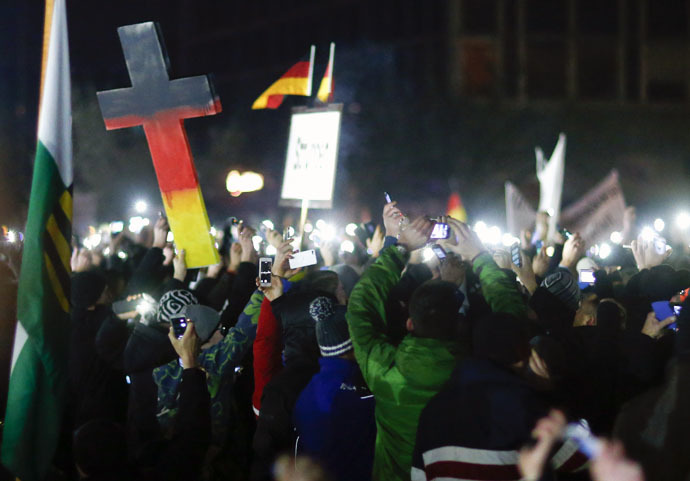 Participants hold up their mobile phones during a demonstration called by anti-immigration group PEGIDA, a German abbreviation for "Patriotic Europeans against the Islamization of the West", in Dresden December 8, 2014. (Reuters)