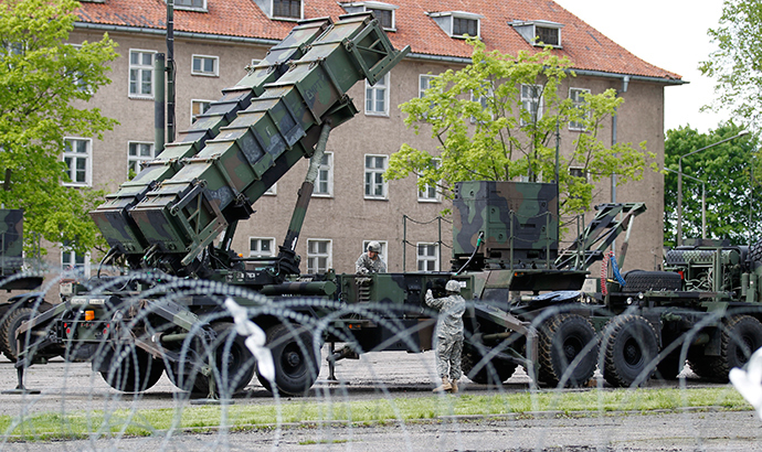 U.S. soldiers stand next to a Patriot surface-to-air missile battery at an army base in Morag, Poland (Reuters)
