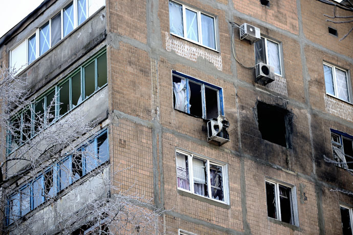 A destroyed apartment block window after a shell hit the building in the Petrovskiy district, of the eastern Ukrainian city of Donetsk which is controlled by Donetsk People's Republic (DNR), on December 2, 2014. (AFP Photo/Eric Feferberg)