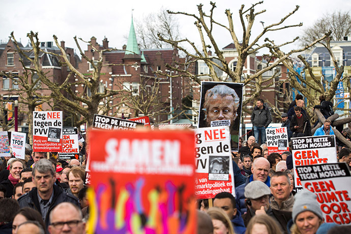 People take part in a protest against Geert Wilders, leader of the Dutch hard-right Freedom Party, in Amsterdam March 22, 2014. (Reuters/Cris Toala Olivares)