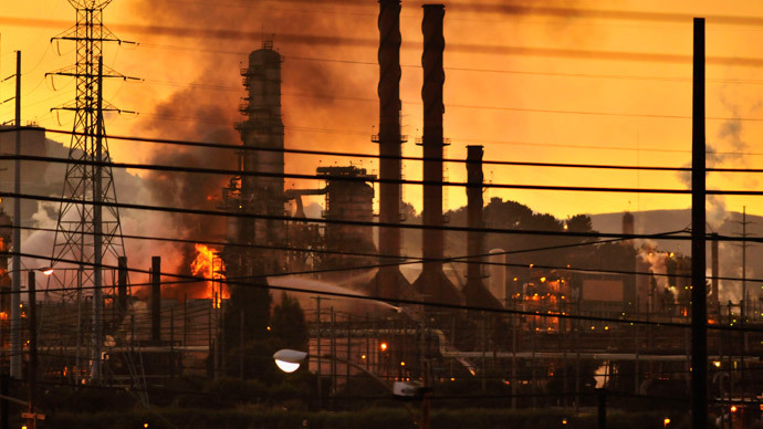 Firefighters douse a flame at the Chevron oil refinery in in Richmond, California August 6, 2012.(Reuters / Josh Edelson)