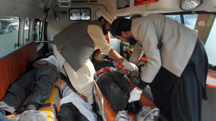 Men move bodies of students, who were killed during an attack by Taliban gunmen on the Army Public School, in an ambulance outside a hospital in Peshawar, December 16, 2014.(Reuters / Stringer)