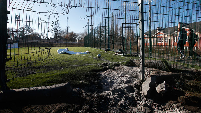 A crater caused by shelling is seen near a school's soccer field in Donetsk, eastern Ukraine, November 6, 2014.(Reuters / Maxim Zmeyev )