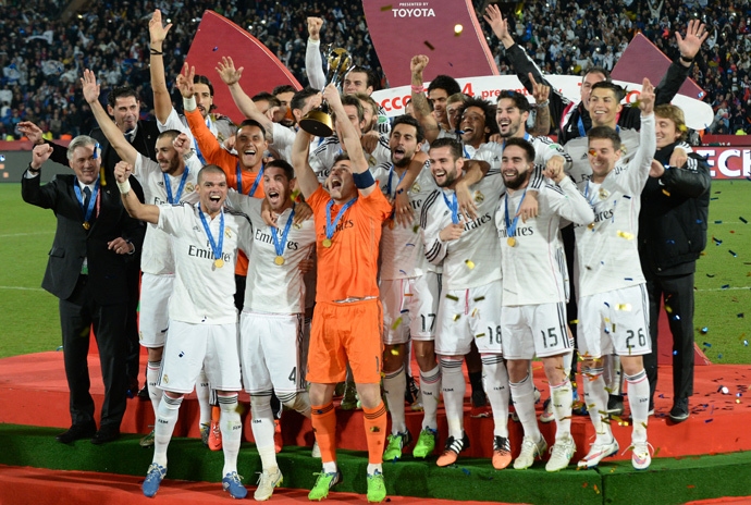 The Real Madrid team celebrate the victory of the 2014 FIFA Club World Cup at the Marrakesh stadium in the Moroccan city of Marrakesh on December 20, 2014. (AFP Photo / Fadel Senna)