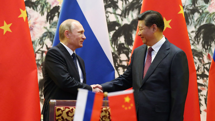 China pledges to help Russia overcome economic hardships