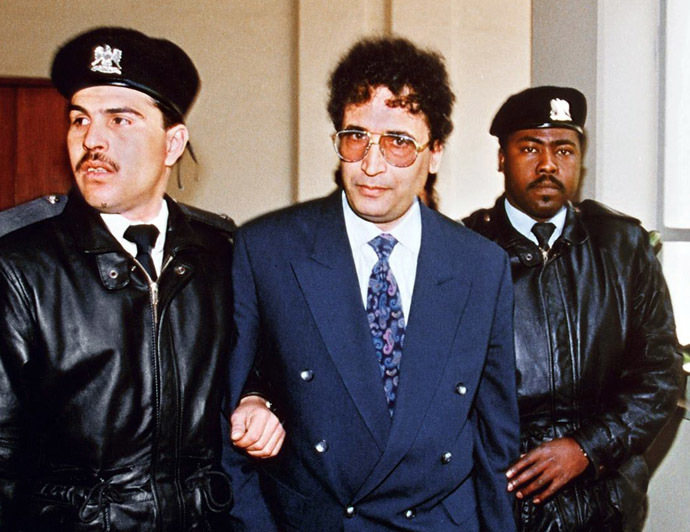 File photo taken February 18, 1992 in Tripoli shows convicted Lockerbie bomber Abdelbaset Ali Mohmet al-Megrahi (C) being escorted by security officers. (AFP Photo/Manoocher Deghati)