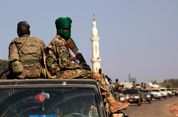 SPLA soldiers sit at the back of a pick-up truck in Bentiu, Unity state (Reuters / Andreea Campeanu)