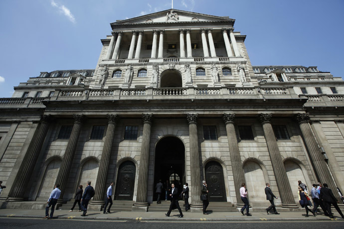 Pedestrians walk past the Bank of England in the City of London (Reuters/Luke MacGregor)