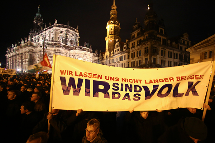 Participants hold a banner during a demonstration called by anti-immigration group PEGIDA, a German abbreviation for "Patriotic Europeans against the Islamization of the West", in Dresden December 22, 2014. (Reuters / Hannibal Hanschke)