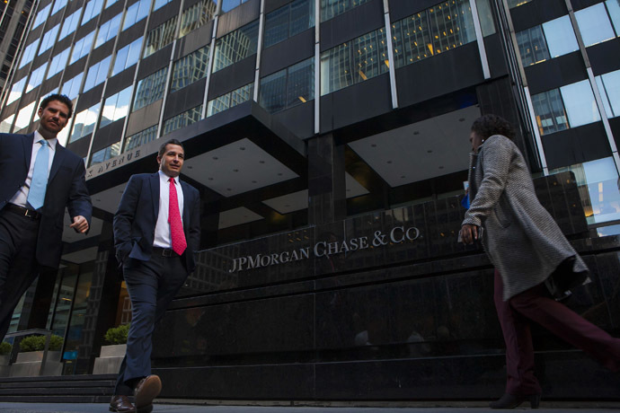 People walk by the JP Morgan & Chase Co. building in New York. (Reuters/Eric Thayer)