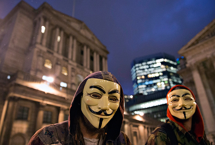 Supporters of the activist group Anonymous wear masks to protest against the BBC outside the Bank of England in London December 23, 2014 (Reuters / Neil Hall)