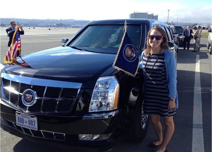 Volunteer driver Natalie Tyson in front of the president's limousine (Facebook)
