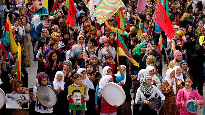 Protesters carry pictures of Abdullah Ocalan, the jailed leader of the Kurdistan Workers' Party (PKK), during a demonstration in support of Kurdish fighters and the besieged citizens of the Syrian town of Kobani and against the Islamic State, in Aleppo's Kurdish neighbourhood of Sheikh Maksoud November 1, 2014 (Reuters / Hosam Katan)