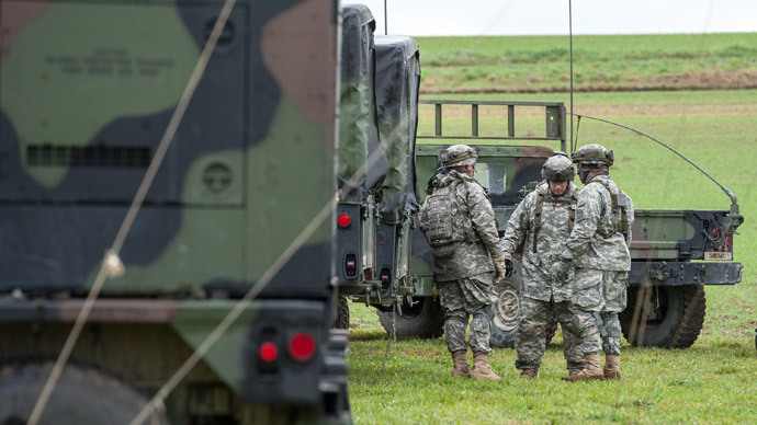 US soldiers stand next to their vehicles at the military training ground in Grafenwoehr, southern Germany.(AFP Photo / Armin Weigel)