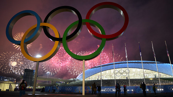 Fireworks explode around the Fisht Olympic Stadium at the end of the Closing Ceremony of the Sochi Winter Olympics on February 23, 2014 at the Olympic Park in Sochi. (AFP Photo/Jonathan Nackstrand)