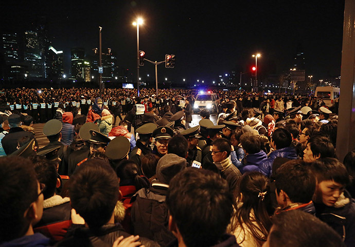 Police control the site after a stampede occurred during a New Year's celebration on the Bund, a waterfront area in central Shanghai, January 1, 2015. (Reuters/Stringer)