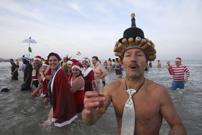 People wearing costumes participate in a traditional New Year's Day swim in Malo-les-Bains, northern France January 1, 2015. (Reuters/Pascal Rossignol)
