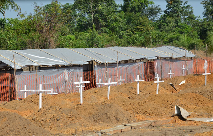 A picture taken in Monrovia on January 3, 2015 shows a cemetery dedicated for the burial of Ebola victims. It is divided in two parts, one for Christians victims, the other for Muslims victims. (AFP Photo/Zoom Dosso)