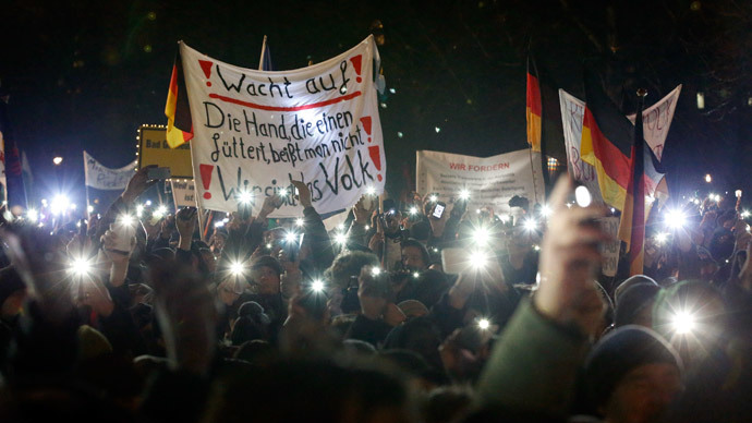 Participants use lights on their portable phones as they take part in a demonstration called by anti-immigration group PEGIDA, a German abbreviation for "Patriotic Europeans against the Islamization of the West", in Dresden January 5, 2015.(Reuters / Fabrizio Bensch)