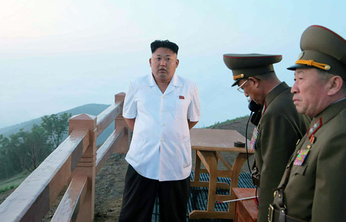 This undated picture released from North Korea's official Korean Central News Agency on June 30, 2014 shows North Korean leader Kim Jong-Un (L) observing a tactical rocket firing drill by the Korean People's Army Strategic Force at an undisclosed place in North Korea. (AFP/KCNA)