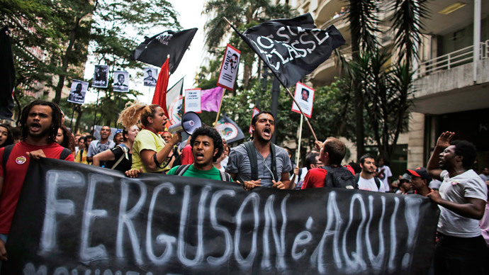 Demonstrators protest against police violence and the Ferguson shooting of Michael Brown, in Sao Paulo.(Reuters / Nacho Doce)