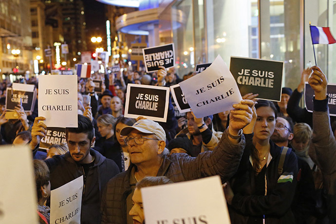 People gather for a vigil outside the Consulate General of France to remember the victims of an attack on satirical magazine Charlie Hebdo in Paris, in San Francisco, California January 7, 2015. (Reuters/Stephen Lam)
