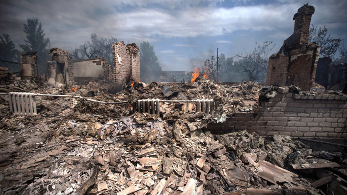 A view of a house destroyed in an air strike carried out by Ukrainian armed forces in the village of Stanitsa Luganskaya (AFP Photo)