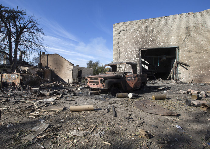 A car and a house burnt during fighting between rebels and Ukrainian government forces are seen near the Sergey Prokofiev International Airport in the town of Donetsk, eastern Ukraine (Reuters/Shamil Zhumatov)