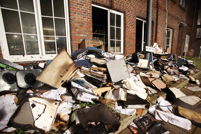 Burnt and damaged files are seen in the courtyard of German regional newspaper Hamburger Morgenpost editorial office in Hamburg, northern Germany, on January 11, 2015 after an arson attack. (Bodo Marks / DPA / AFP )