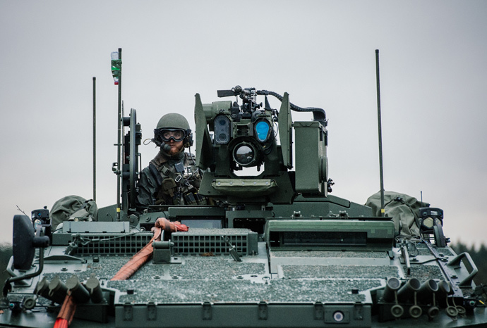 A soldier from the Swedish Armed Forces, looks on from top of the Patria XA-360 AMV (Armored Modular Vehicle) at Hagshult Airbase (AFP Photo / Jonathan Nackstrand)