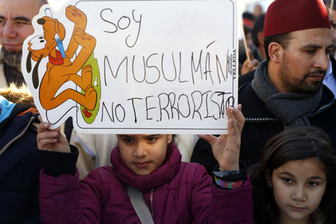 A girl holds a placard that reads "I am a Muslim, not a terrorist" during a rally by members of the Muslim community of Madrid on January 11, 2015. (Reuters)