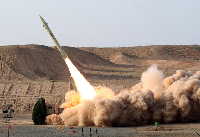 Test firing its home-built surface-to-surface Fateh 110 missile (AFP Photo / HO / Vahid Reza Alaei)