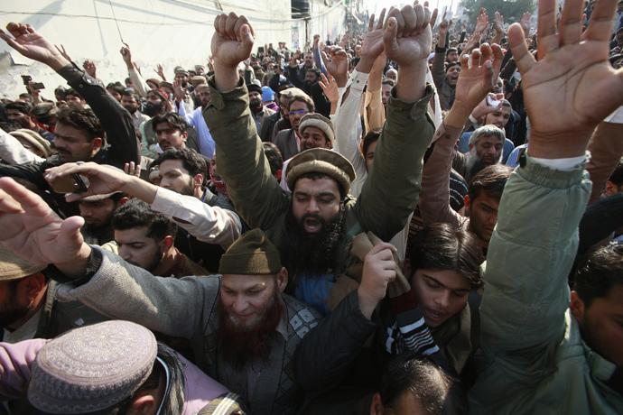 Supporters of religious groups protests against satirical French weekly newspaper Charlie Hebdo, which featured a cartoon of the Prophet Mohammad as the cover of its first edition since an attack by Islamist gunmen, in Lahore January 16, 2015. (Reuters / Mohsin Raza)