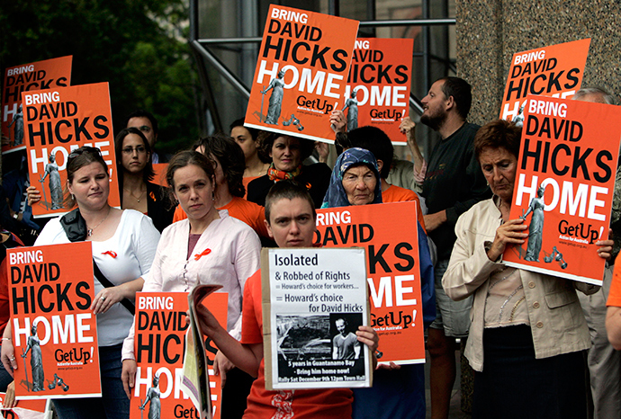 ARCHIVE PHOTO: Protesters hold placards during a rally outside the federal court in Sydney December 15, 2006 (Reuters / Tim Wimborne)