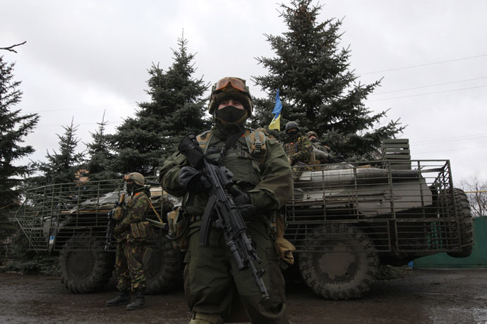 Ukrainian servicemen patrol an area near the eastern Ukrainian town of Debaltseve in Donetsk region (Reuters/Valentyn Ogirenko)