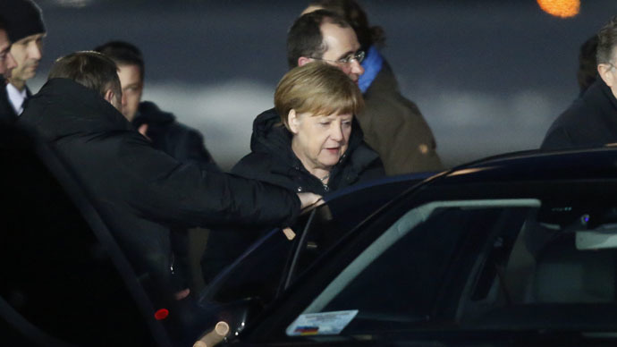 German Chancellor Angela Merkel gets into a car upon her arrival at Moscow's Vnukovo airport February 6, 2015. (Reuters/Sergei Karpukhin)
