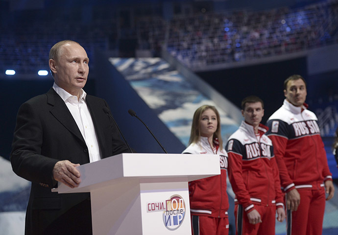 Russia's President Vladimir Putin (L) delivers a speech as he attends a show, dedicated to the first anniversary of the opening of the 2014 Sochi Winter Olympic Games, at the Iceberg Skating Palace in Sochi February 7, 2015. (Reuters/Alexei Nikolskyi/RIA Novosti)