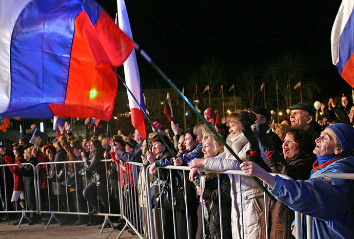 Simferopol residents on the central square watching celebratory fireworks after the ascension of Crimea into the Russian Federation. (RIA Novosti/Taras Litvinenko)