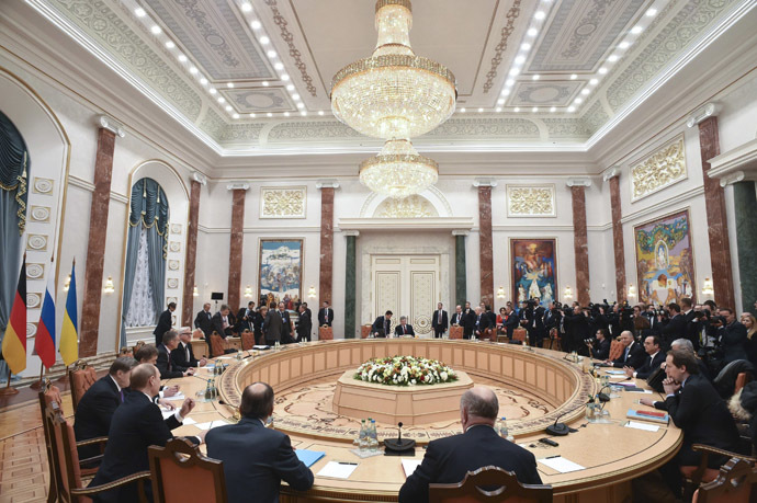 Members of delegations from Russia, Ukraine, Germany and France take part in peace talks on resolving the Ukrainian crisis in Minsk, February 11, 2015. (Reuters/Kirill Kudryavtsev)